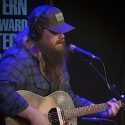 Hijinks Ensue as Chris Stapleton Performs “Broken Halo” & Talks New Album With Howard Stern [Watch]